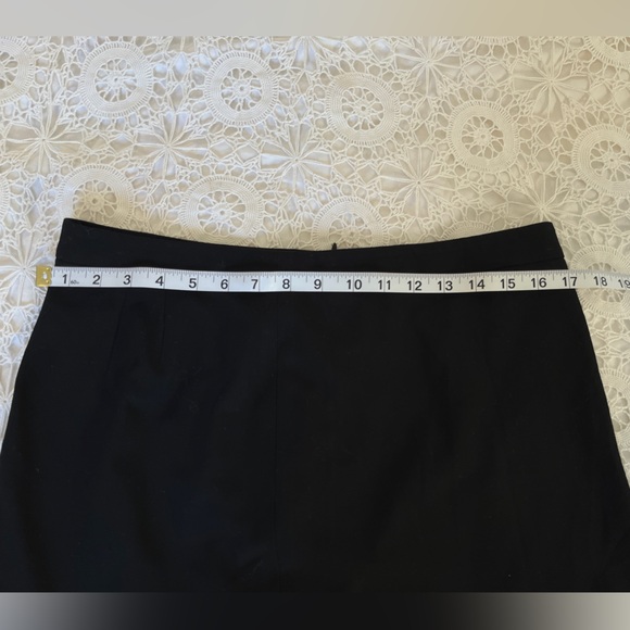 The limited black pleaded asymmetrical miniskirt - Picture 7 of 7